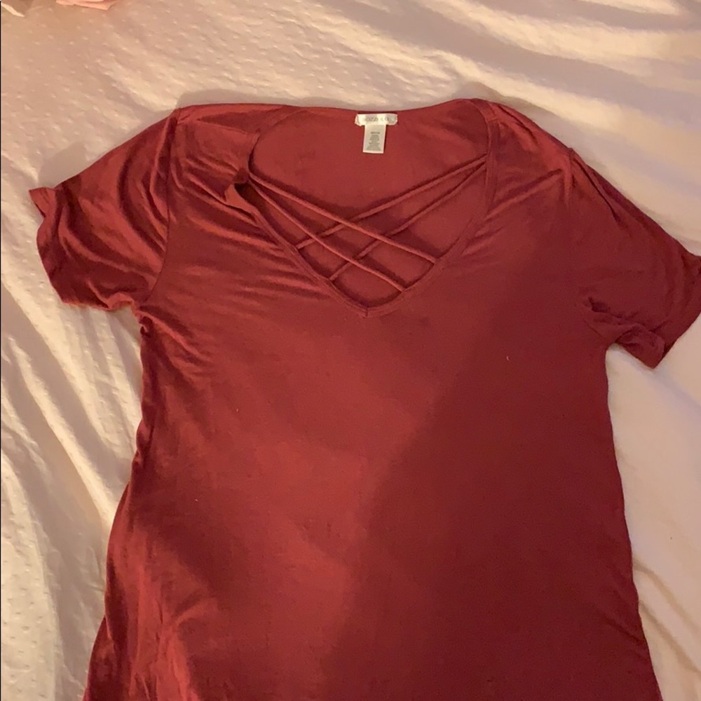 dark pink shirt with cutouts in front